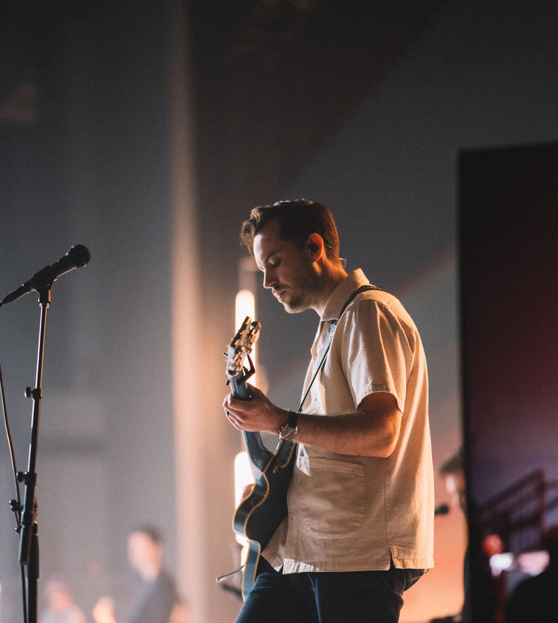 Band A man playing a guitar