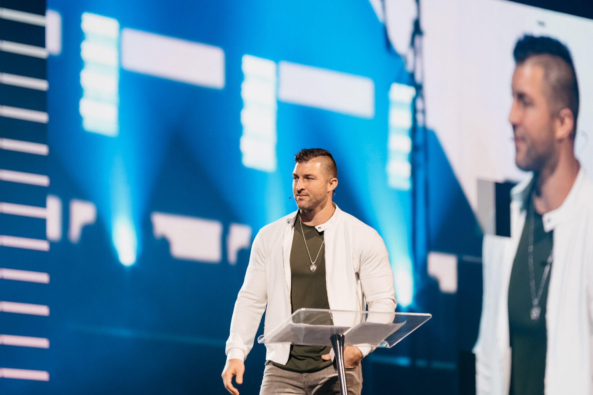 Tim Tebow Tim Tebow speaking on stage at a conference